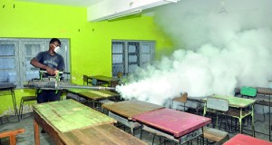 A CMC worker fumigating a classroom. Pix by Indika Handuwala