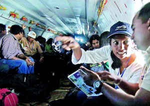 On war coverage: Mel Gunasekera together with her journalist colleagues flying to the war zone during the height of the Sri Lanka’s civil war. AFP Photo/Ishara Kodikara