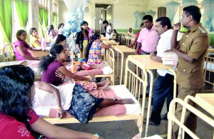 Factory employees receiving treatment. Pic by S. Siriwardena