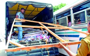 Down come  banners and  cut-outs in Galle. Pix by D.G. Sugathapala