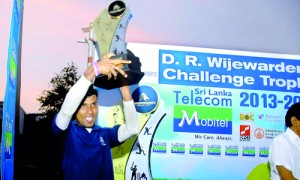 The winning captain Vijaya Wagarachchi with the D.R. Wijewardena Challenge Trophy