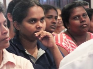 In a pensive mood: One of the participants  at  the meeti ng.  Pic by Quintus Perera