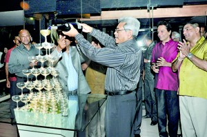 Defence Secretary Gotabaya Rajapaksa does the honours while former Army Commander Jagath Jayasuriya and popular actor Ravindra Randenya among others look on