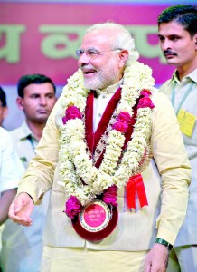 Bharatiya Janata Party (BJP) prime ministerial candidate and Chief Minister of the western Indian state of Gujarat Narendra Modi smiles as he attends the national convention of the Confederation of All India Traders (CAIT) in New Delhi on February 27, 2014. Modi, tipped in opinion polls to be the country's next premier, remains a polarising figure accused by critics of turning a blind eye to anti-Muslim riots in Gujarat in 2002 in which as many as 2,000 died. He has denied any wrongdoing. AFP