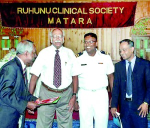 SLMA’s 2013 President Dr. B.J.C. Perera receives the Guidelines from Dr. Malik Fernando in November last year, while Surgeon Lieutenant Dr. Buddhika Lokugamhewa who represented the Navy’s Director-General of Health Services and Consultant Neurologist Dr. P.J.P. Peiris look on.