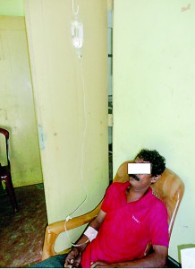 Lack of facilities: A patient receiving  an IV drip while seated