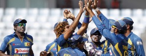 Sri Lanka's fielders celebrate with teammate Lasith Malinga as he dismissed Pakistan's Ahmed Shehzad during their 2014 Asia Cup final match in Dhaka on March 8, 2014. However, would they come down from their stance on the Guarantee money standoff with the SLC. - AFP