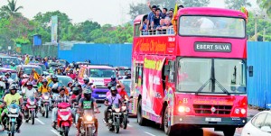 Flanked by thousands of fanatic fans the Lankan national team coming home from Bangladesh with the Asia Cup which they won beating defending champions Pakistan in the final. Now the question lies if they would make their trip back to that country to take part in the ICC T-20 World Championships. - AFP