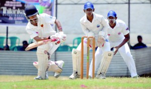 Trinity allrounder Raveen Sayer plays defensively during his knock of 43 not out against St. Anthony’s at Asgiriya yesterday - Pic by Ranjith Perera