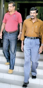 JVP’s Tilvin Silva and Lal Kantha leave the Election’s Commissioner’s office after lodging a complaint regarding the attack on their street drama recently