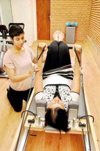 Theruni at work on a patient on the Reformer. Pix by Indika Handuwala