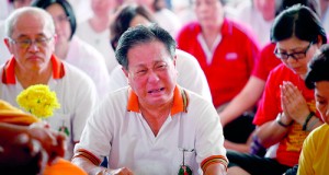 A man cries as Buddhists hold a special prayer for family members of passengers onboard the missing Malaysia Airlines flight MH370 in a temple in Subang Jaya yesterday. Reuters