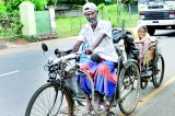 On a bicycle made  for his mother