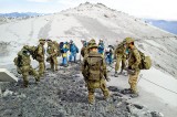 Three more bodies found on Japan volcano as typhoon nears