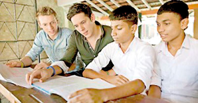 Rob and Paul Forkan with youngsters in Sri Lanka.  Pix courtesy Lee Thomson and Annie Oswald