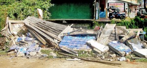 The damaged stage at Wanduramba: The stage was damaged in an attack by goons hours before Opposition Common Candidate Maithripala Sirisena was to address a meeting.