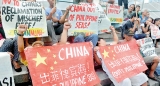 China building runway in disputed South China Sea, say reports