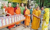 Bangladeshi Buddhist monks feed fasting Muslims over Ramadan