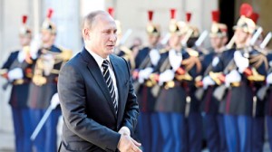 Russian President Vladimir Putin arrives at the Elysee Palace, on October 2, 2015 in Paris, for a peace summit on the Ukraine conflict. The leaders of France, Germany, Russia and Ukraine meet in Paris to consolidate a fragile peace in Ukraine, as the conflict that appears to be winding down is overshadowed by President Vladimir Putin's dramatic intervention in Syria's war. AFP