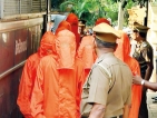 Red card for orange uniform:  New suits for suspects draw  criticism from religious leaders