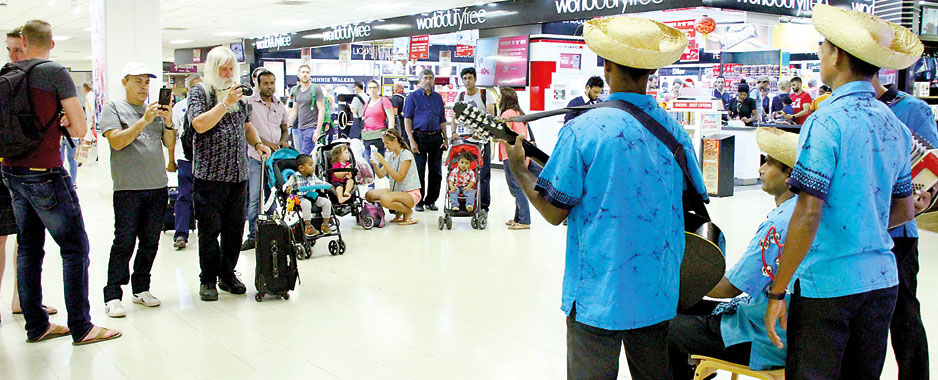 Passengers  hang around at  airport and face the music