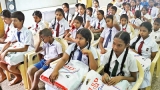 Students from Matara with books from a donor