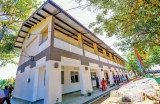 Students await President Sirisena’s arrival to open new School building