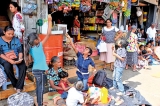 School children playfully await Perahera