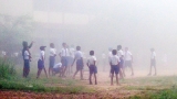 Mist blurs the way to school