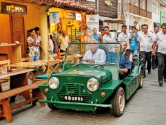 PM driven in an old car in an old fort