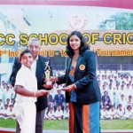 Chamila Heenatigala of NCC, the receives the Best Batsman's award from Madhuri Samuddhika, the special guest
