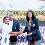 Kithma Sithmal of Sanath Jayasuriya CF receiving the Best Bowler's award from Madhuri Samuddhika while Nelson Mendis, the Director CCC School of Cricket looks on