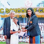 Gimantha Dissanayake of NCC Cricket Academy receiving the Best Fielder's award from Madhuri Samuddhika