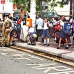 Barricades in place: Schoolboys file past security points