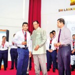 The Gold Excellence winner Jagath  Samarasinghe  congratulated by  John Amarathunga, Minister of Tourism Development, Wild Life and Christian Religious Affairs