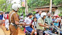 Police take measures to ensure the safety of children who travel to school on motorbikes