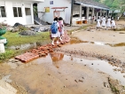 It’s muddy hell for  these students  of  Agalawatte  primary school