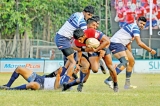 Red Shirts      prevail over Sailors in         scrappy game
