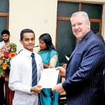 An Award winner receiving his  certificate from the Chief Guest His Excellency David Holly. Australian High Commissioner for Sri Lanka
