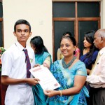 An Award winner receiving his  certificate from the Dean of College of Chemical Sciences Prof. Sagarika Ekanayake