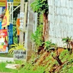 Andriyas and Stive Sabrina (left) from Switzerland walking back to thier hotel room in Mirissa after a visit to a nearby grocery shop