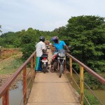 The narrow and dilapidated bridge that is currently in use.