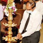 Mr. Mudhita Somaratna, lighting the oil lamp