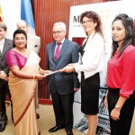 Roshani-Leanage,-Chairperson-MODART-Sri-lanka-branch-receiving-the-agreement-from-LAurence-Piette-,-Director-MODART-Paris