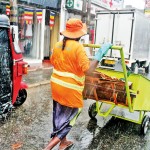 Rain or shine: Municipal workers carry on