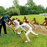 Young cricketers being  trained at the Southern  cricket coaching camp