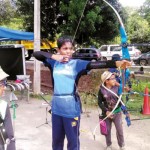 Nifla Azoor taking part in archery before switching to rifle shooting