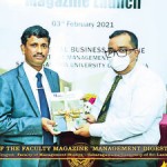 Handing over the journal to  the Chief Guest