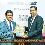 Handing over the magazine  to the Chief Guest