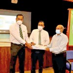 Handing over confirmation certificates to  Mr Hilary Costa (President of Past Teachers Association) by the project Chairman  Mr Darshaka Fernando